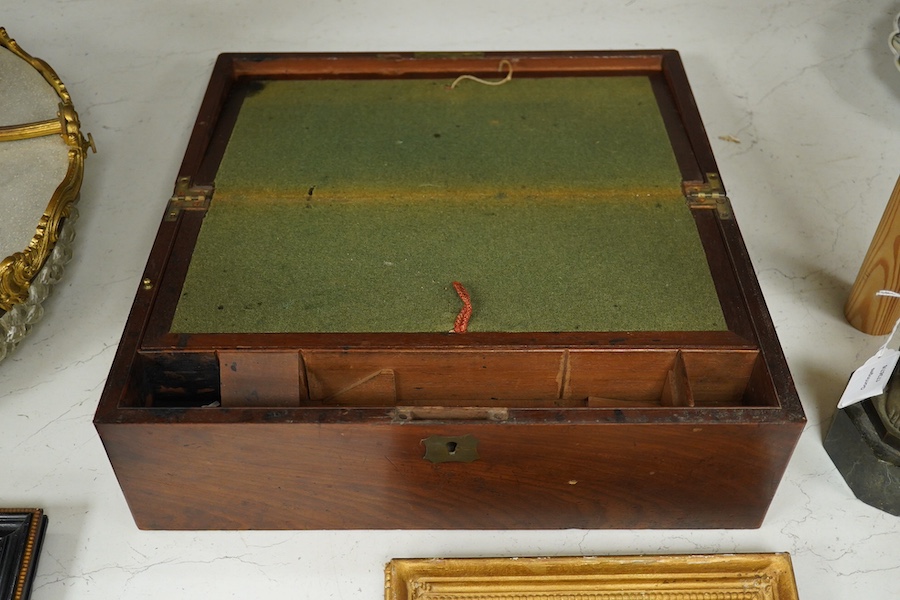 A 19th century brass handled figured mahogany writing slope, 42cm wide, 16cm high. Condition - brass inset plaque to top missing